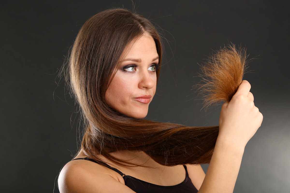 what causes dry frizzy ends