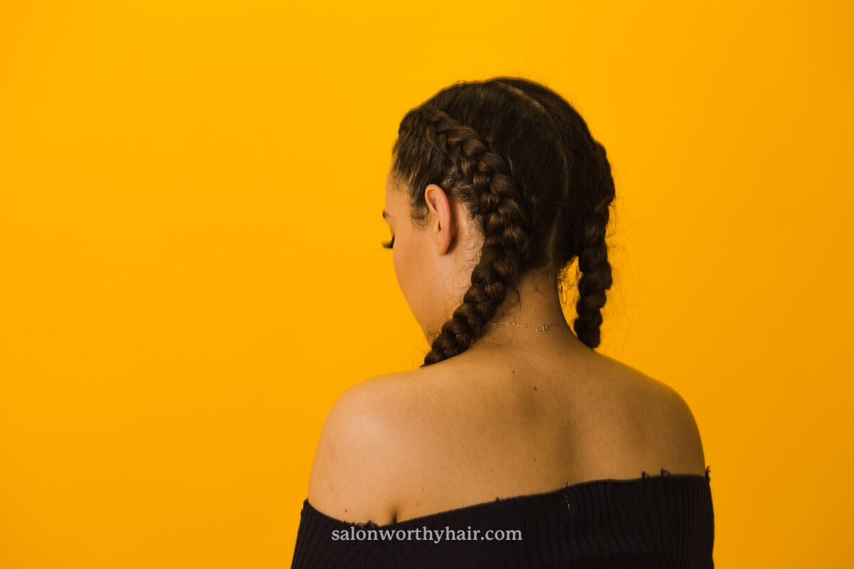 curly haired girl classic braiding style