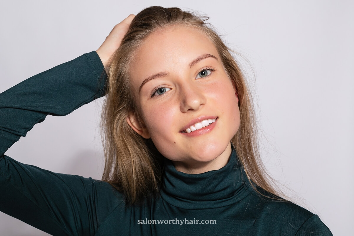 touching hair too much can make hair greasy
