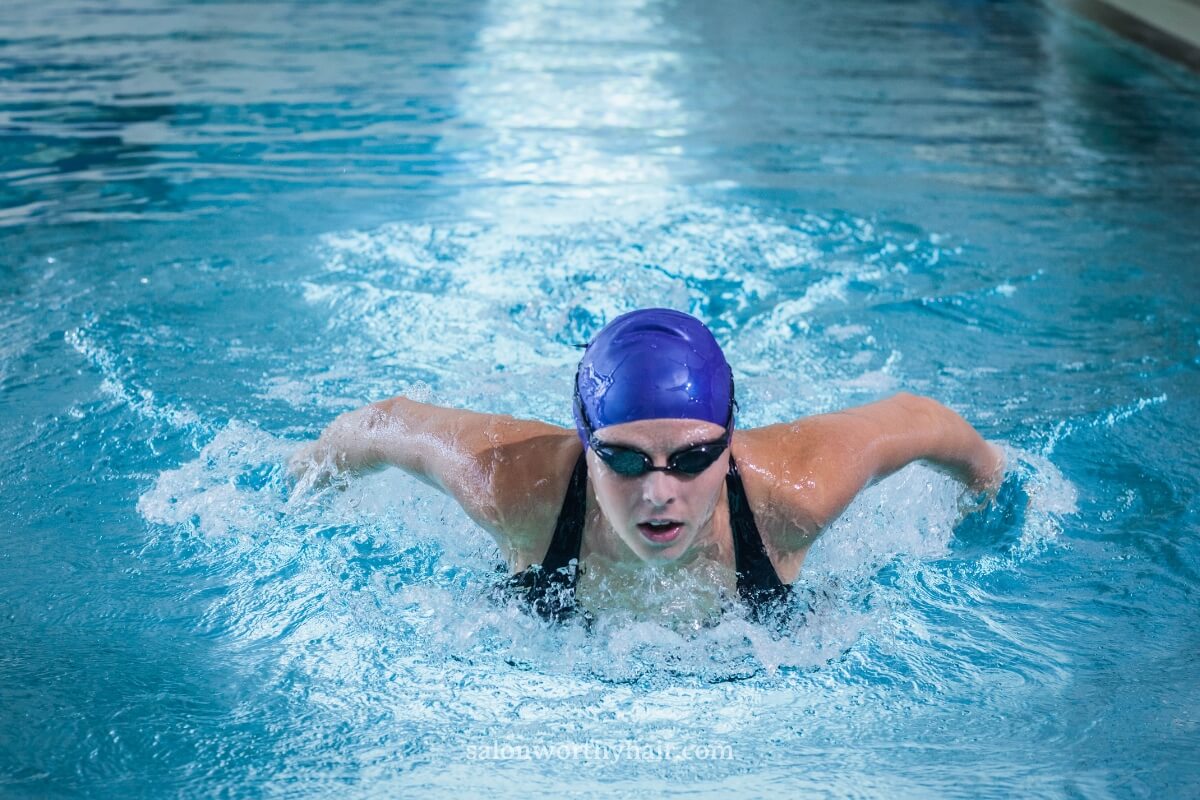 competitive swimmers create more movements that build water pressure on the cap