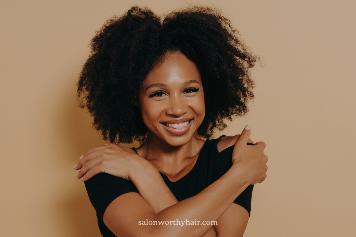 frizzy natural hair means afro-textured hair texture and curl pattern rather than damage.