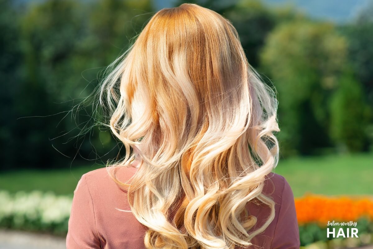 Woman with apricot blonde hair color