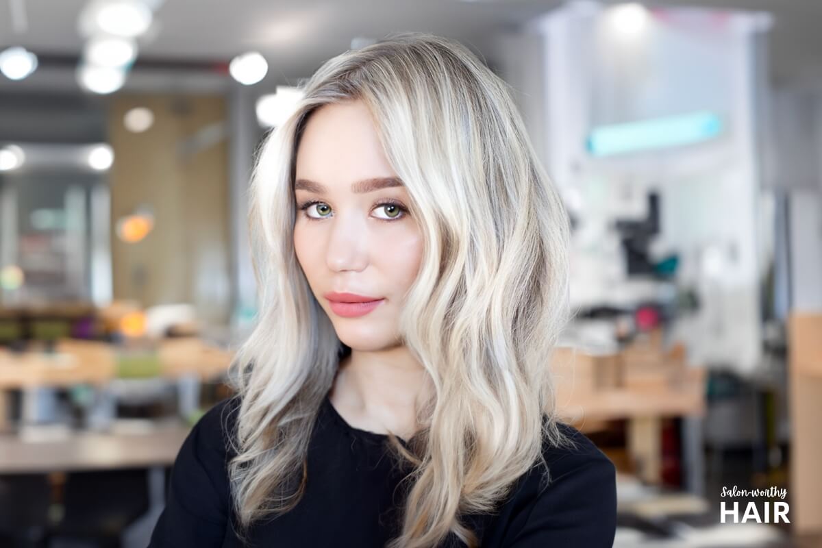 Pearl blonde is a luminous blonde with cool, silvery-blue undertones, resembling the shimmer of a pearl.