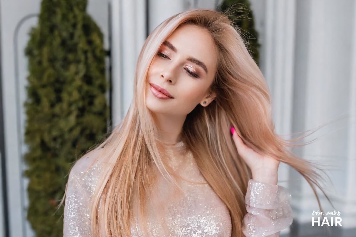 Rose gold blonde blends pinkish-red tints with golden undertones