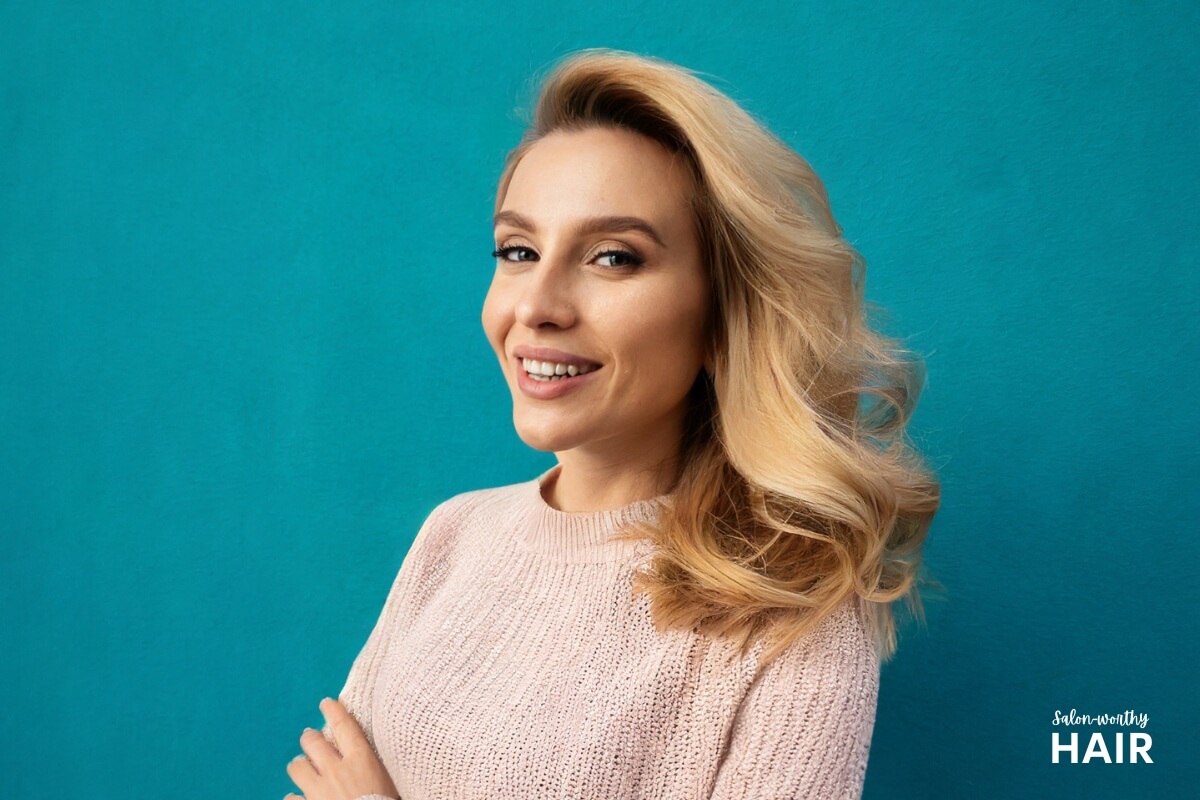 Warm blonde has golden undertones, sun-kissed highlights, and rich depth define warm blonde, complementing skin with warm hues.
